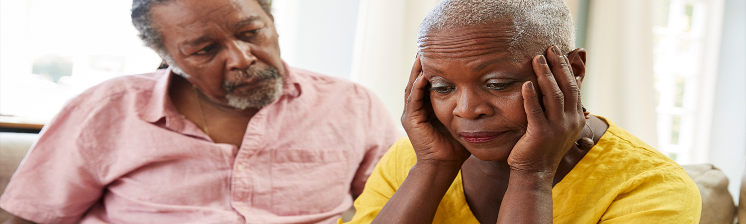 Senior man comforting senior woman