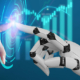 Photo illustration showing a human hand touching a robotic hand with digital imagery coming out of their touchpoint